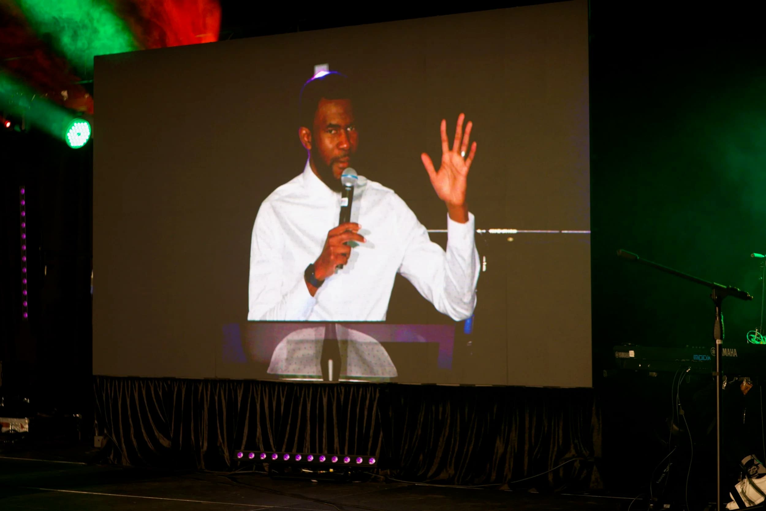 Close-up of a speaker on an IMAG LED wall at an Ottawa live event