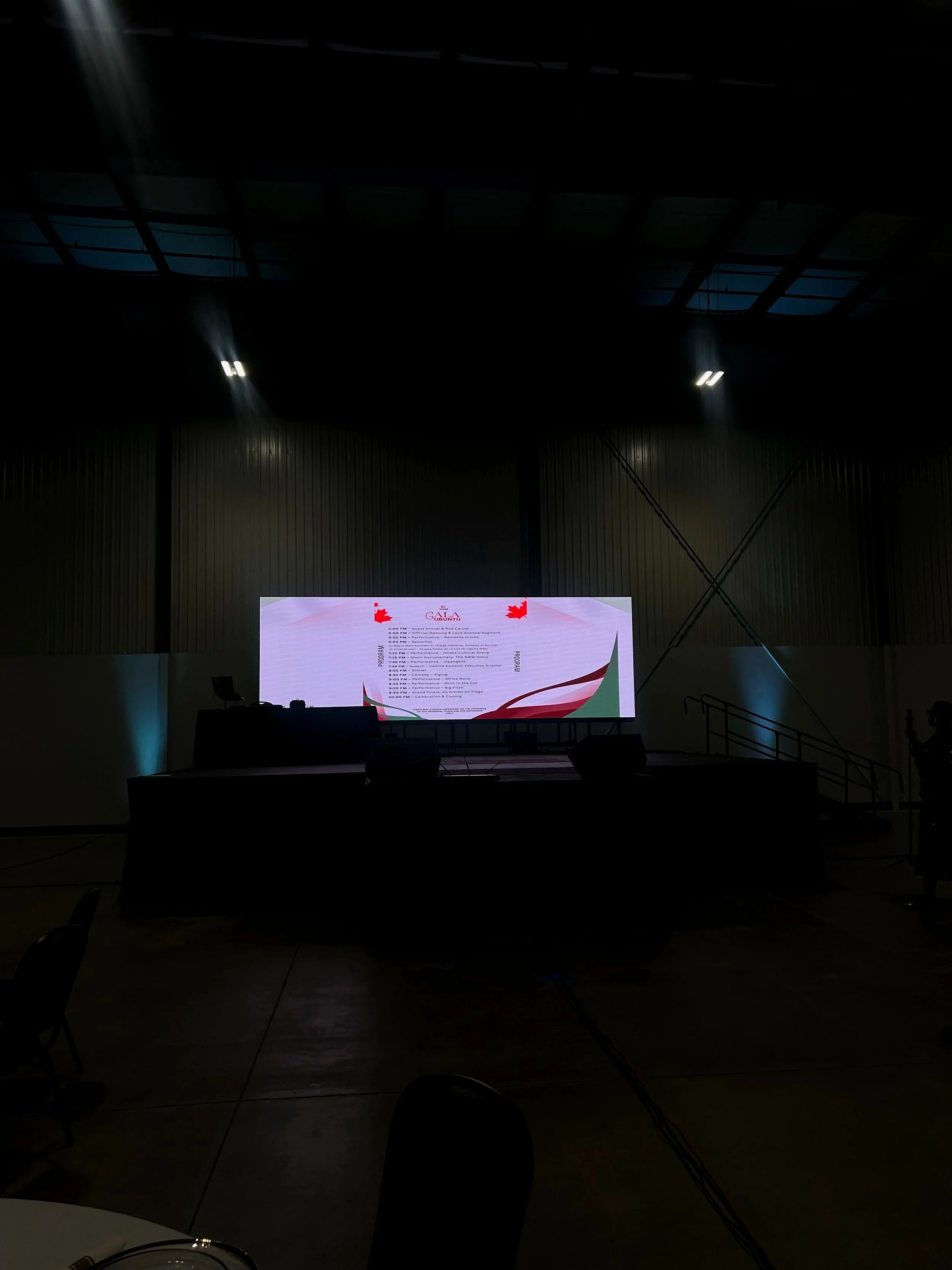 Wide corporate LED wall on stage at an Ottawa gala showing the program