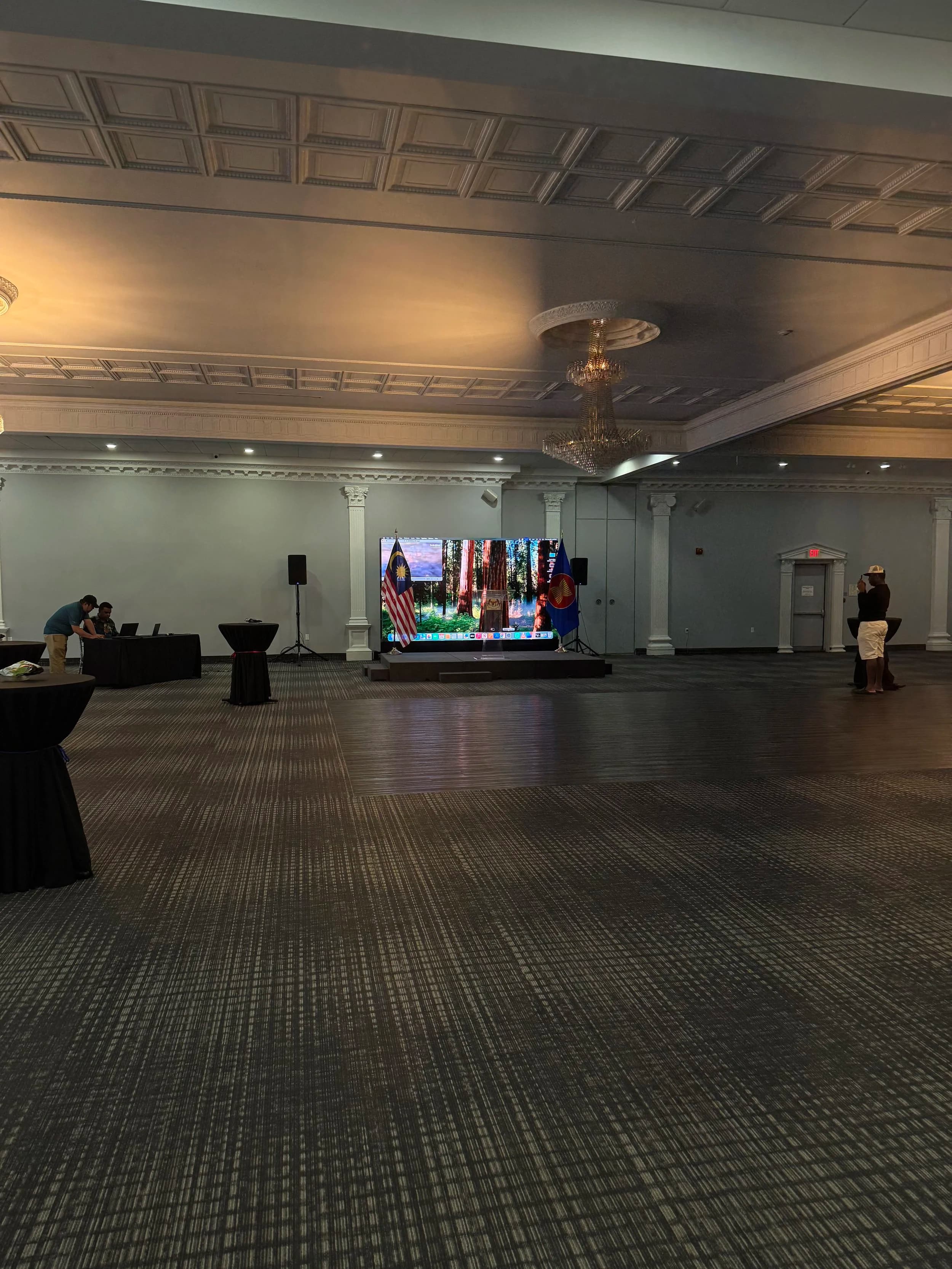 Wide view of our LED wall on stage at an Ottawa embassy reception ballroom with Malaysia and ASEAN flags