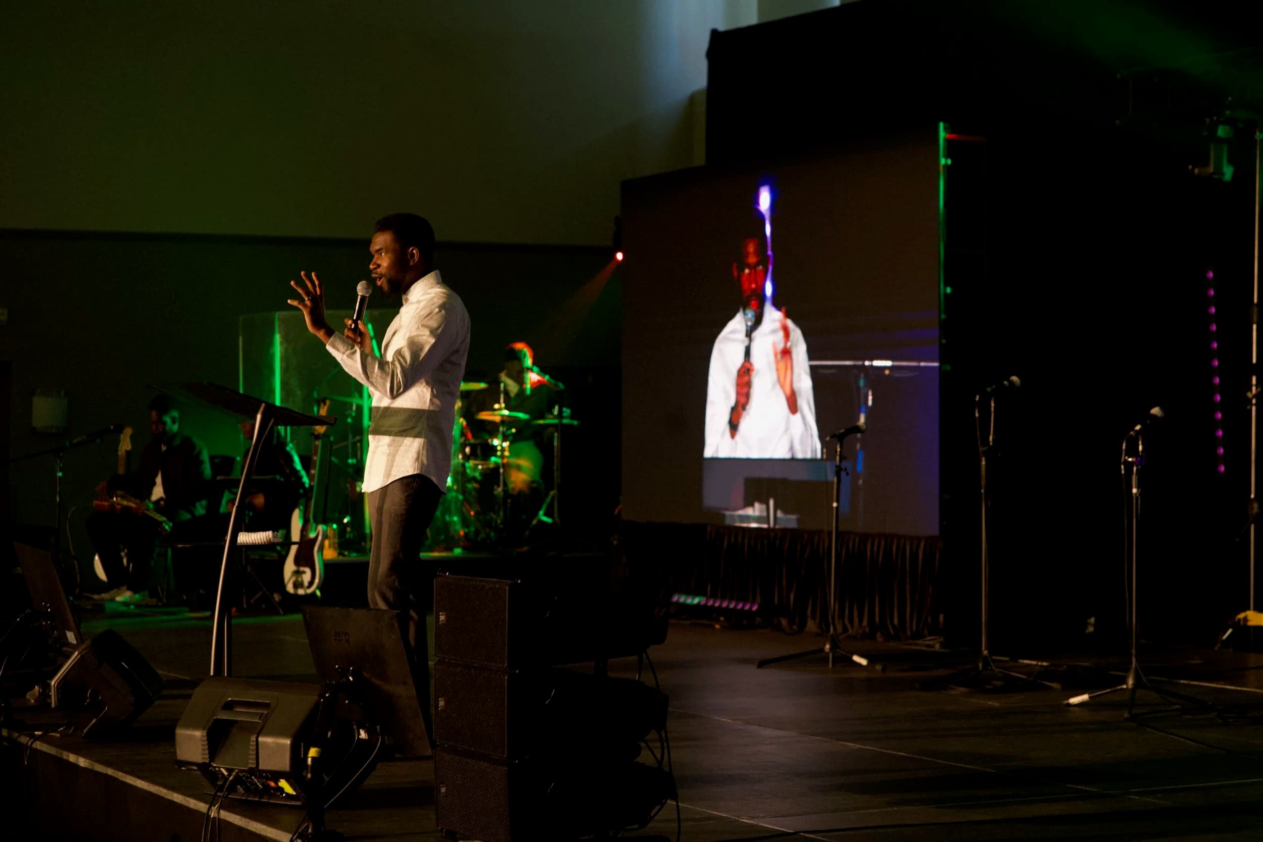 Speaker on stage at an Ottawa gathering with their image magnified live on our LED wall behind them