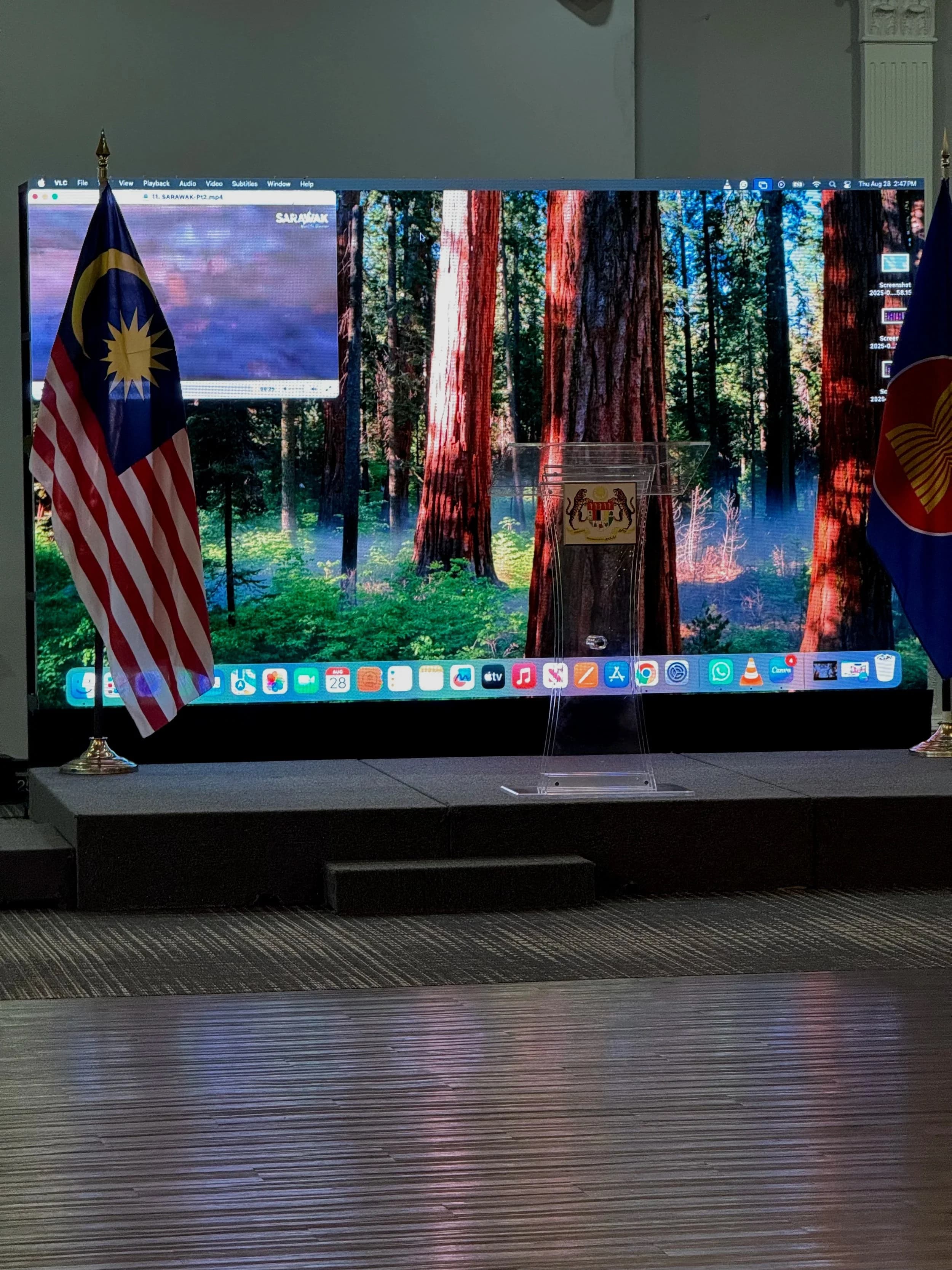 Close-up of our LED wall at an Ottawa embassy reception, flanked by Malaysia and ASEAN flags