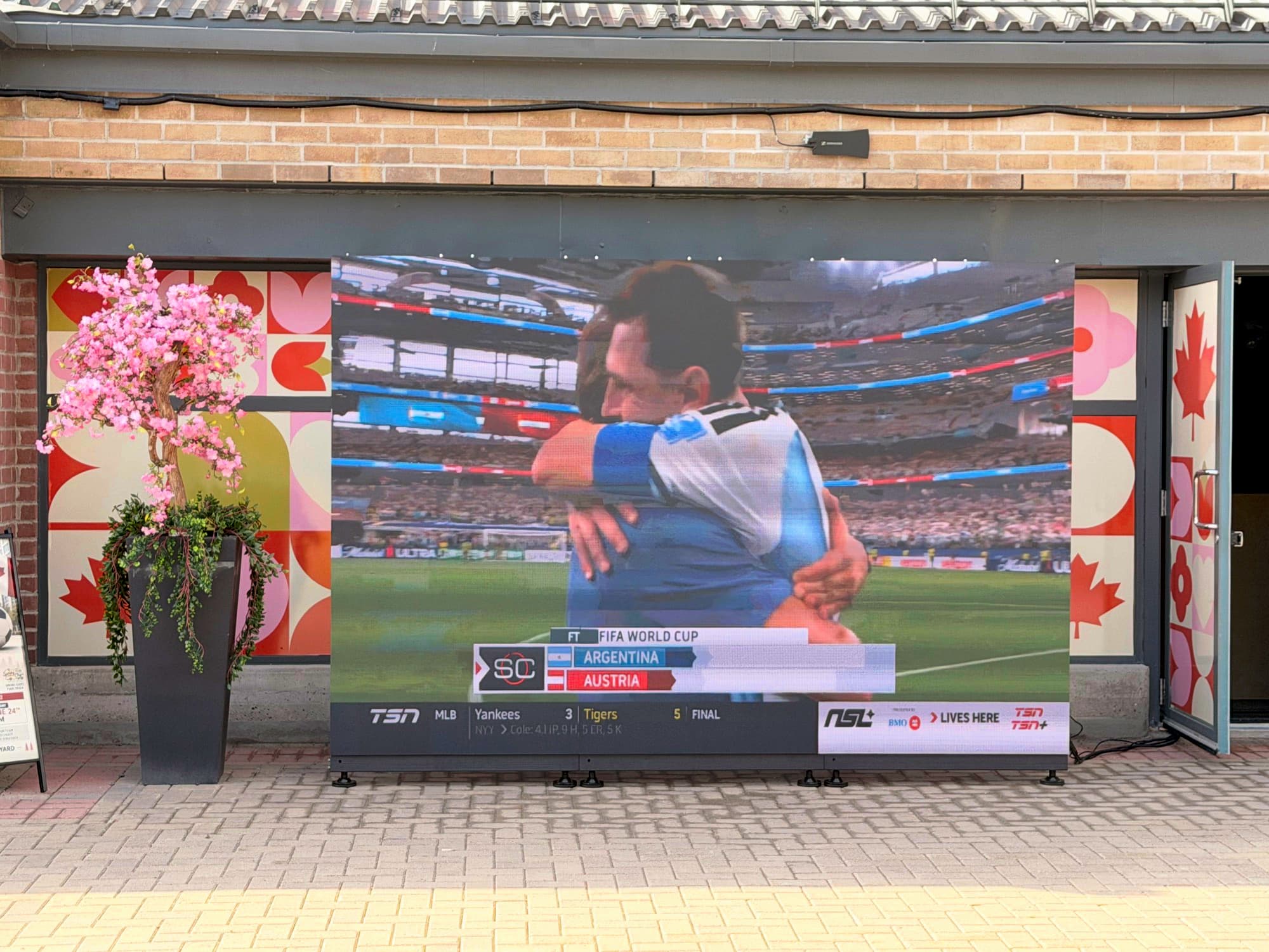 FIFA World Cup match playing live on our outdoor LED wall — the viewing experience guests remember